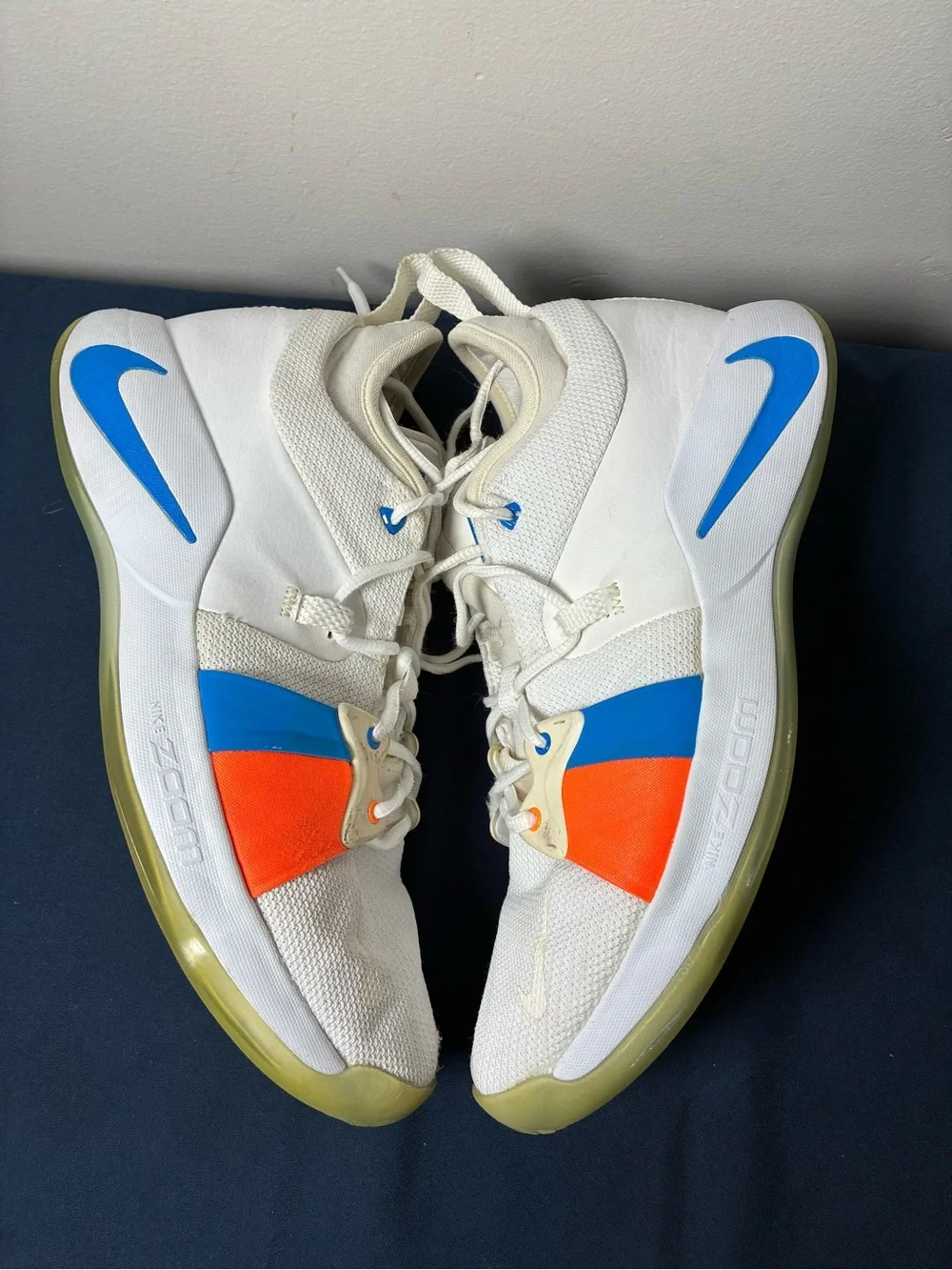 Nike White Youth Athletic Sneakers with Blue & Orange Accents